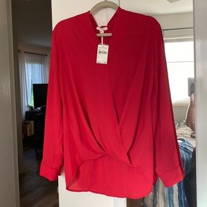Red blouse by Pleione.  100% polyester.  Twist front and adjustable sleeves.